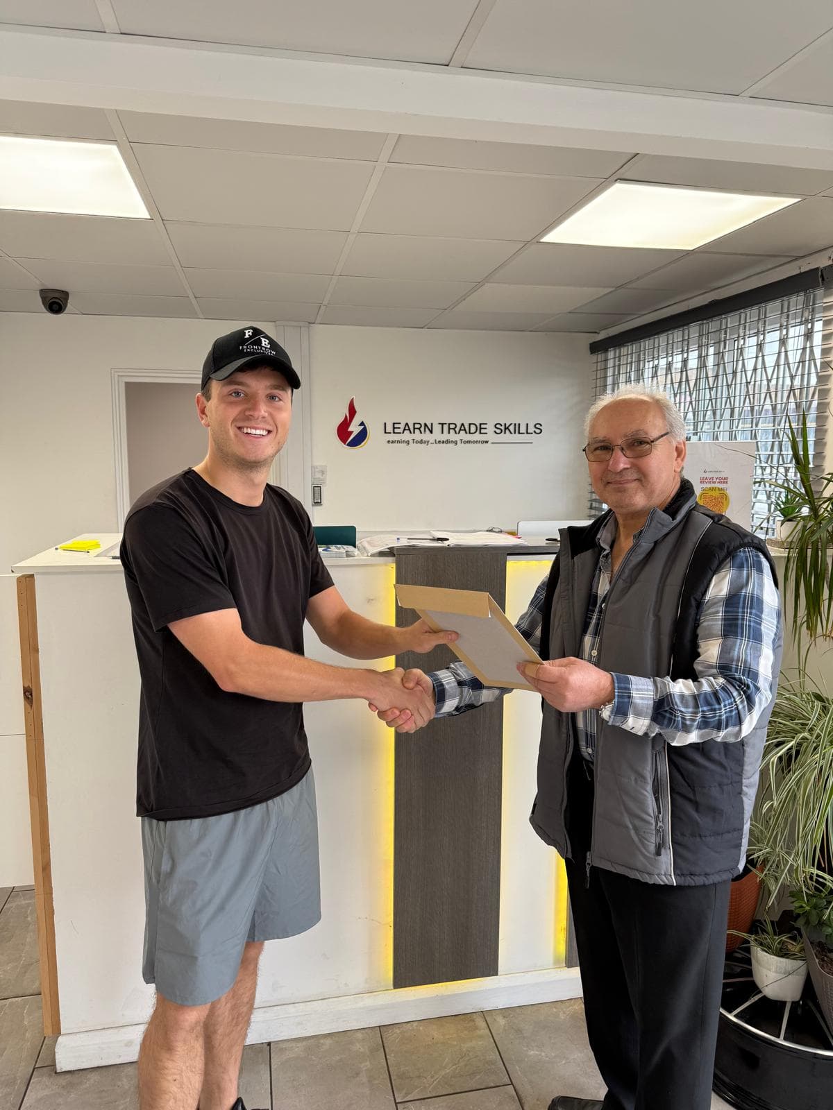 Graduate receiving certificate at LTS reception