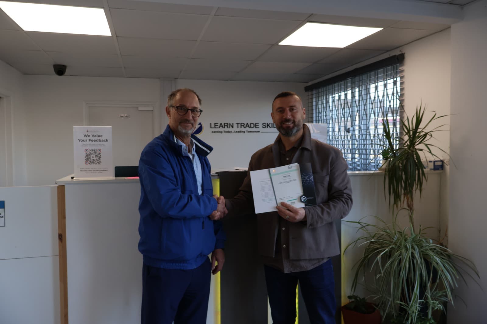 Student receiving qualification certificate at LTS