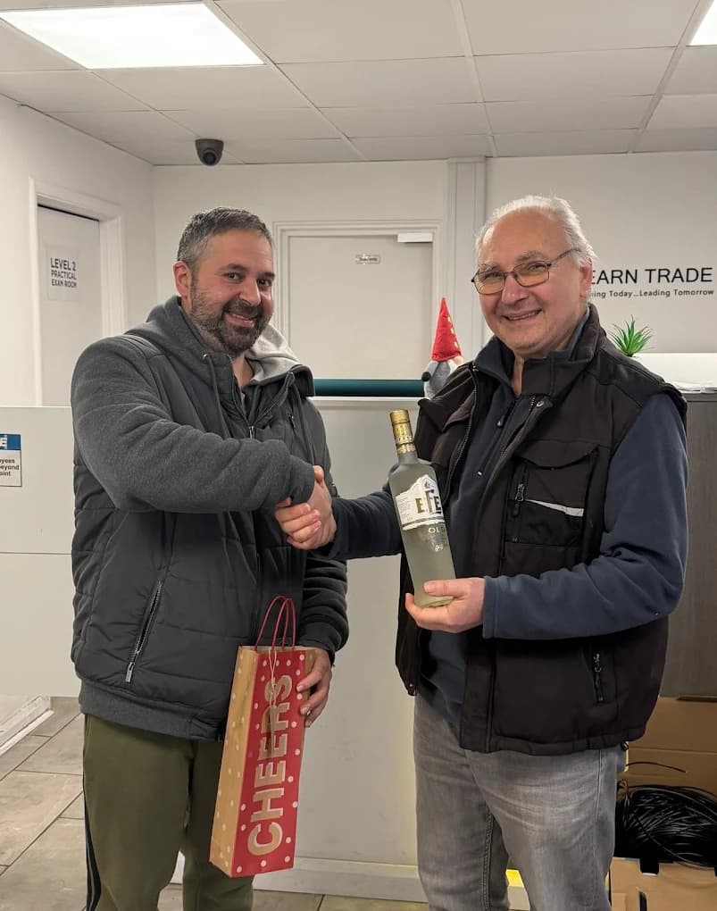 Student presenting a gift to instructor at LTS