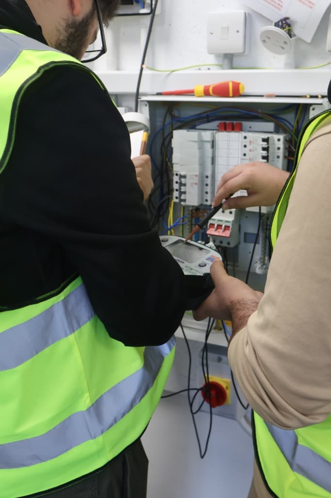Students practising electrical testing