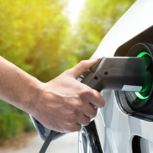 Electric,Vehicle,Charging,Station.,Hand,Charging,An,Electric,Car,(ev)