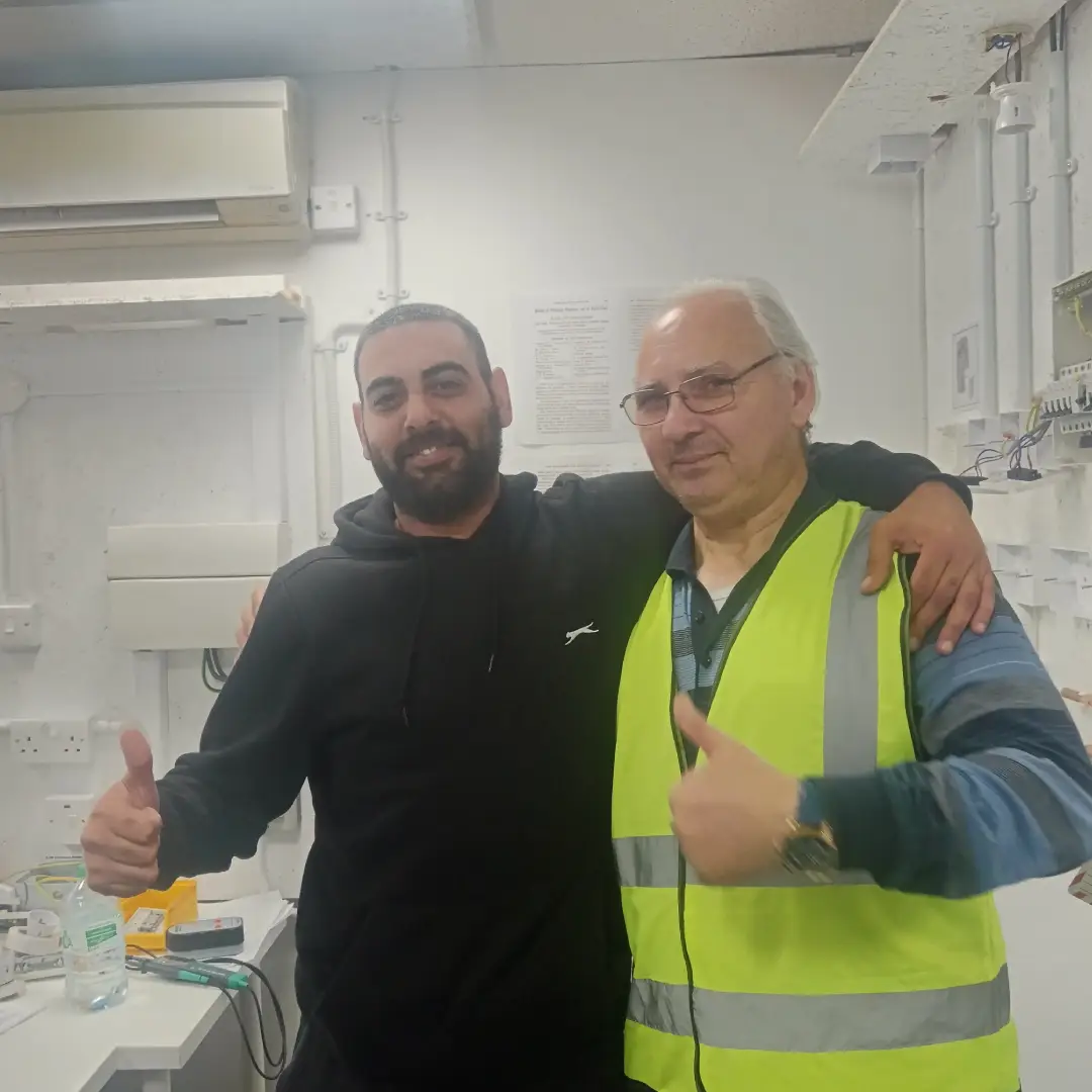 family run business picture showcasing Sezai aramaz director of LTS taking picture with a studen
