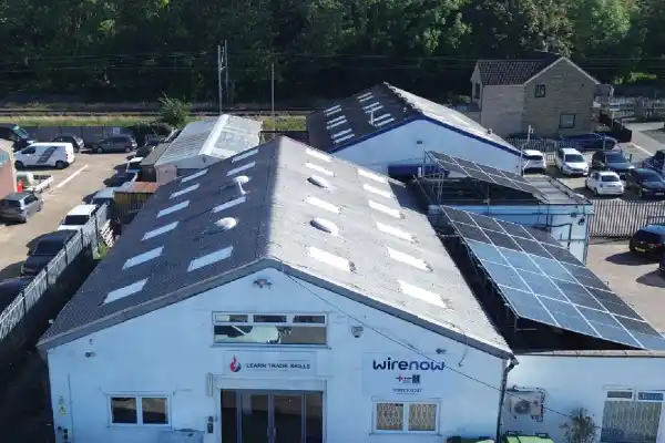 Wire Now Ltd and Learn Trade Skills training centre in Hertfordshire featuring rooftop solar panels installed by students as part of a renewable energy project.
