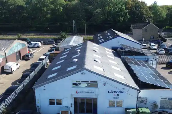 Aerial view of the Learn Trade Skills and WireNow training centre, featuring solar panels on the roof and workshop facilities for electrical and renewable energy training in the UK.