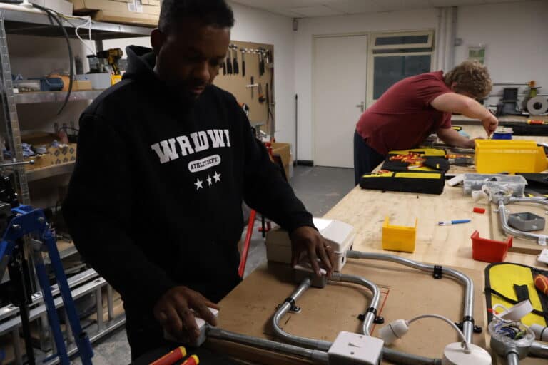 A student electrician working through Level 2 training, representing progress toward becoming a qualified electrician.